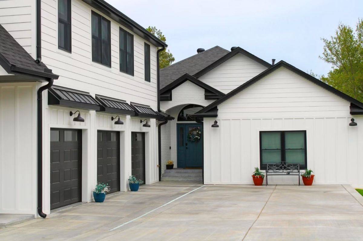 Completed exterior remodel with new siding, trim and metal roof accents